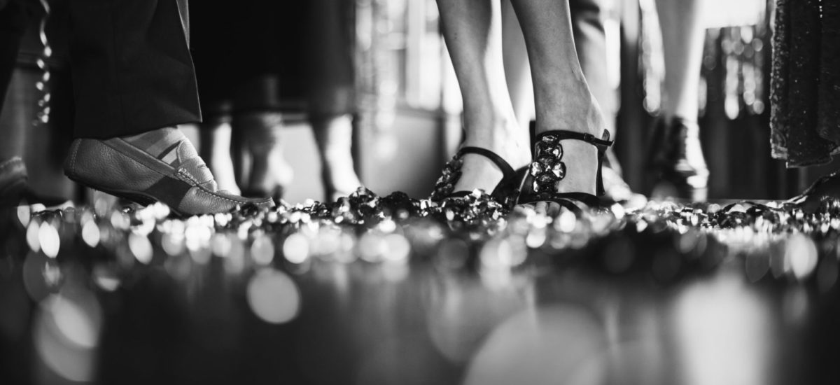 Friends celebrating on the dance floor Close up of the dance floor